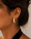 Close-up of White Rhinestone Diamond Hoops featuring diamond-inspired white rhinestone detailing