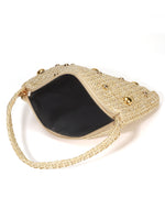 Gold handbag with decorative elements on a white background