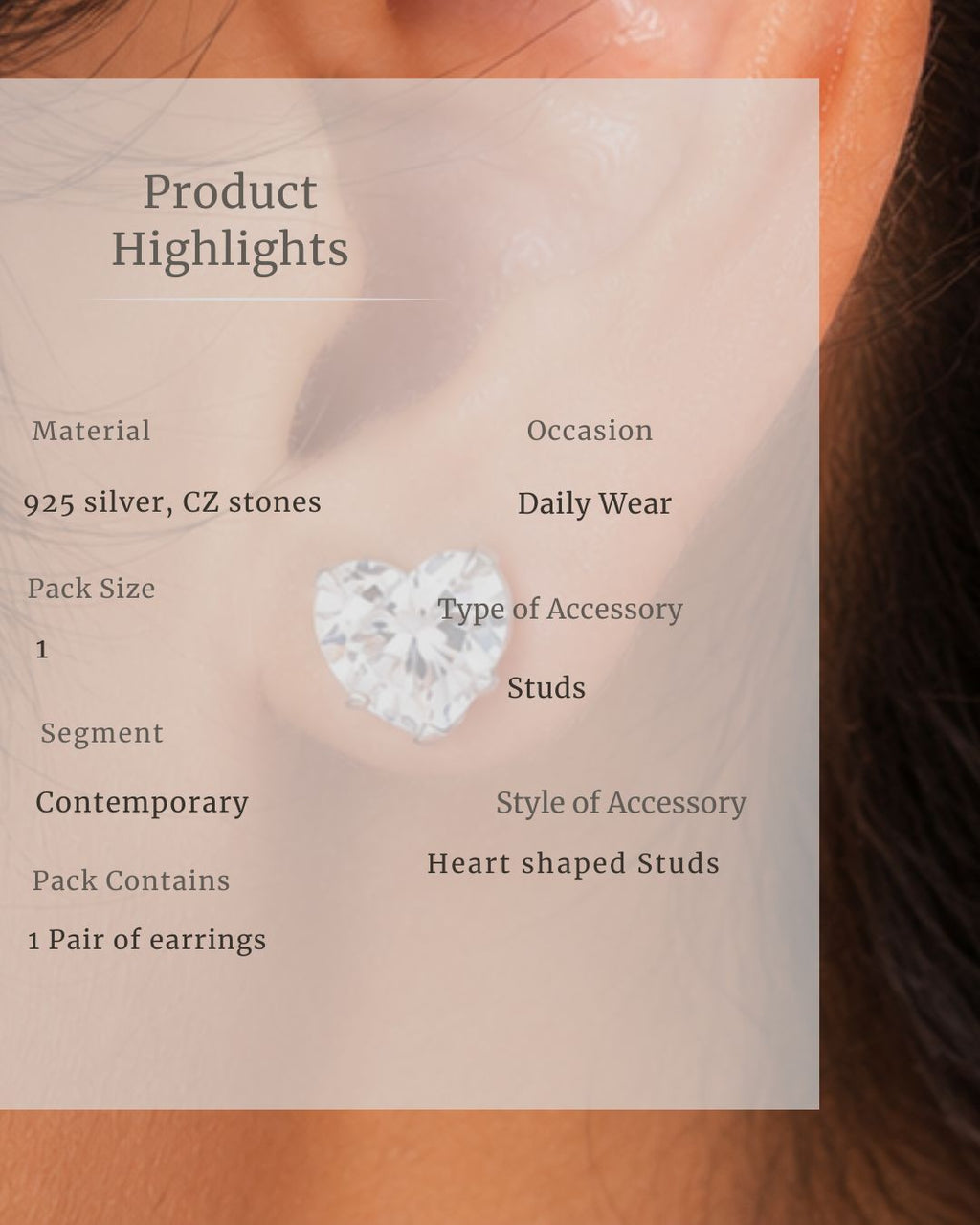 Heart-shaped stud earring with product details overlay on a blurred background