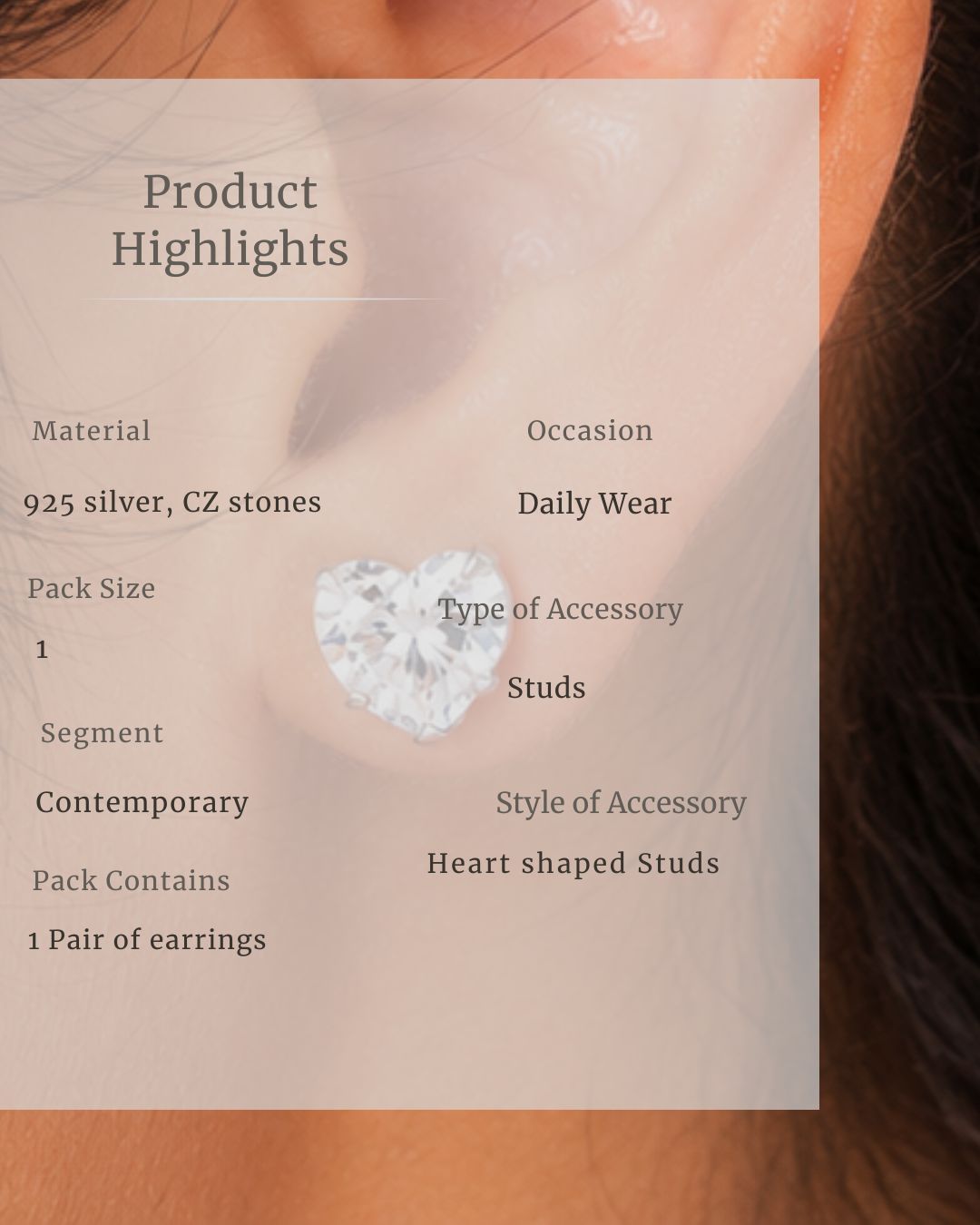 Heart-shaped stud earring with product details overlay on a blurred background