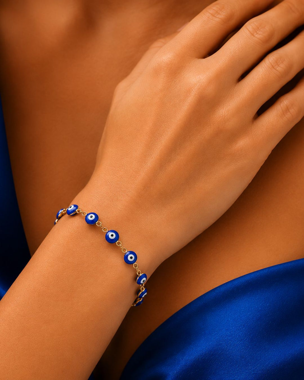 Adjustable blue evil eye bracelet for women with gold plated finish
