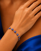 Adjustable blue evil eye bracelet for women with gold plated finish