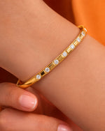 Gold bracelet with diamonds on a wrist 