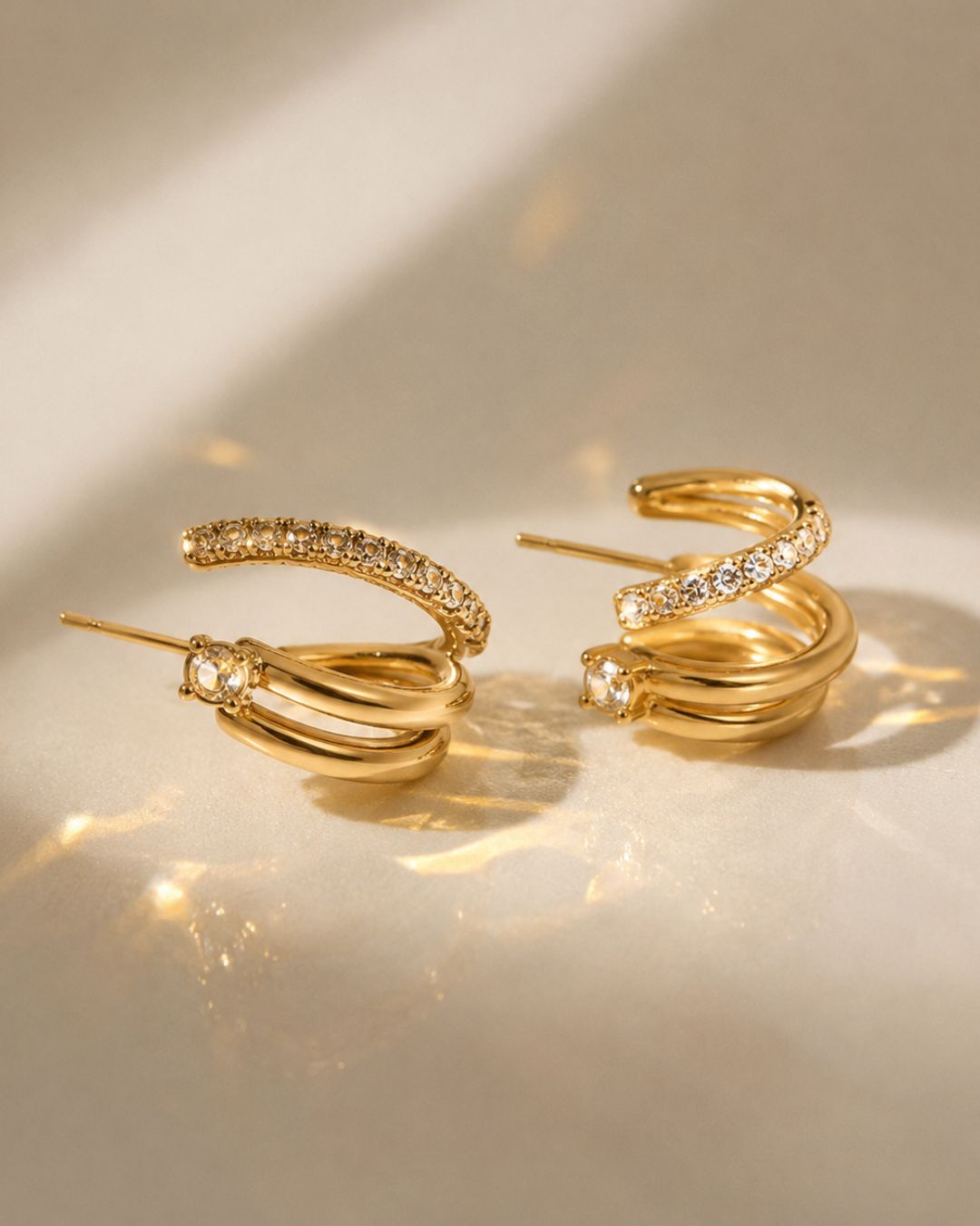 Detailed view of Ciara's Diamond Overlay Studs crafted in stainless steel with gold plated finish