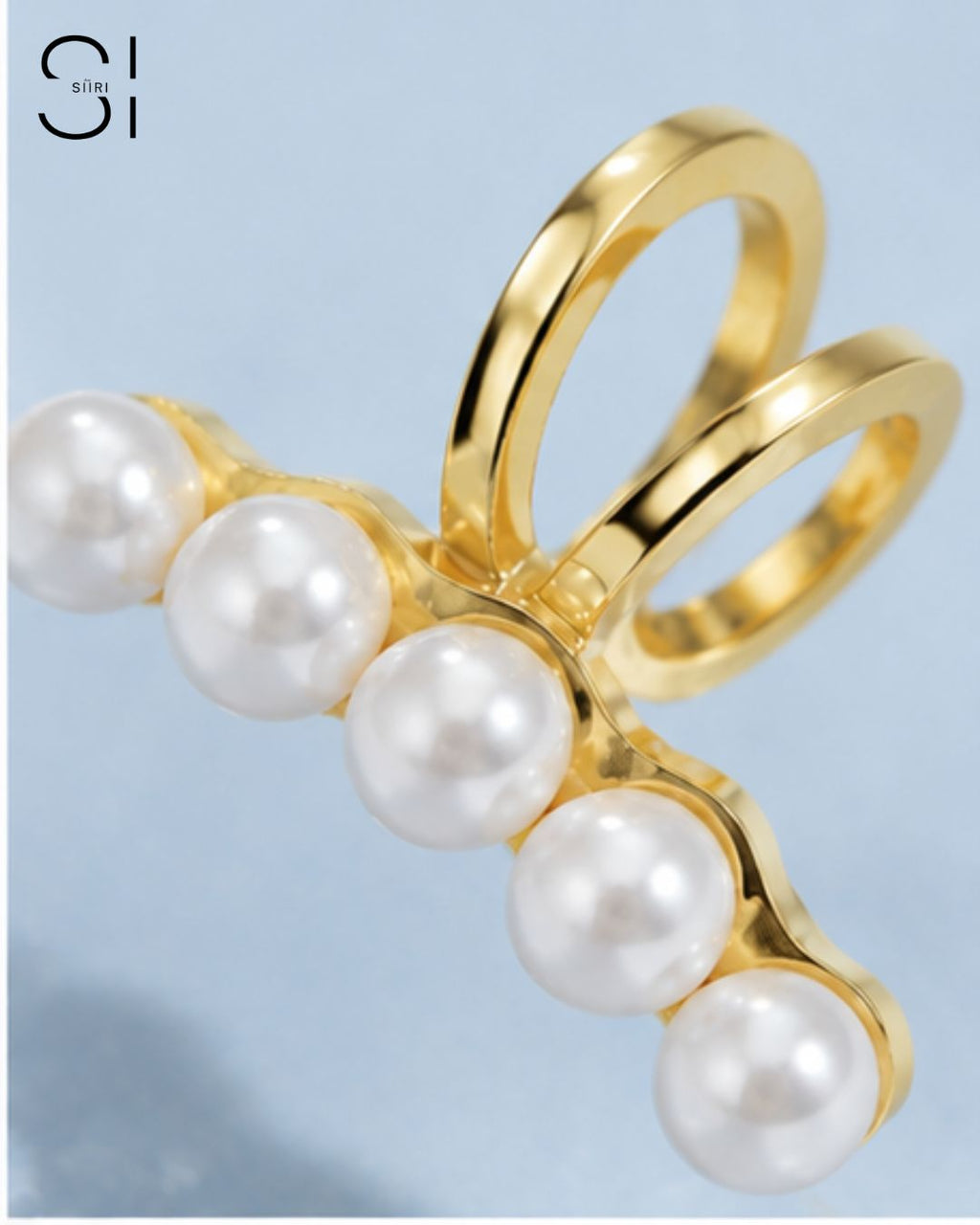 close up of pearl ear cuff