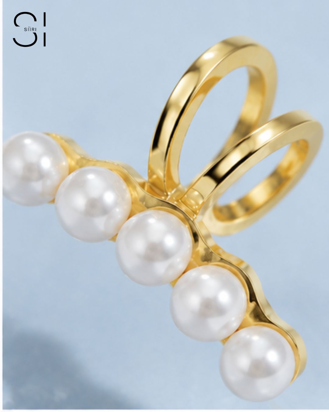 close up of pearl ear cuff