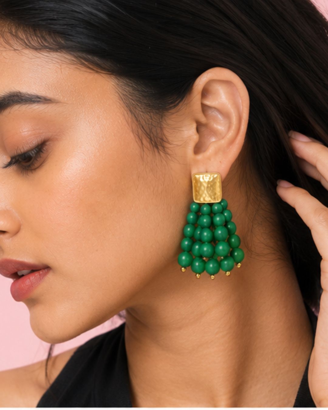 Model wearing Emerald Bead Cascade Earrings with vibrant green bead detailing close up