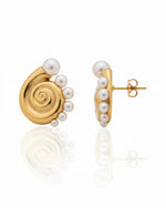 Close-up of Conch Pearl Statement Earrings featuring elegant pearl detailing and sculptural design
