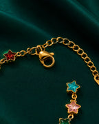 Detailed view of Cosmic Star Charm Bracelet with adjustable chain and colorful crystal star detailing