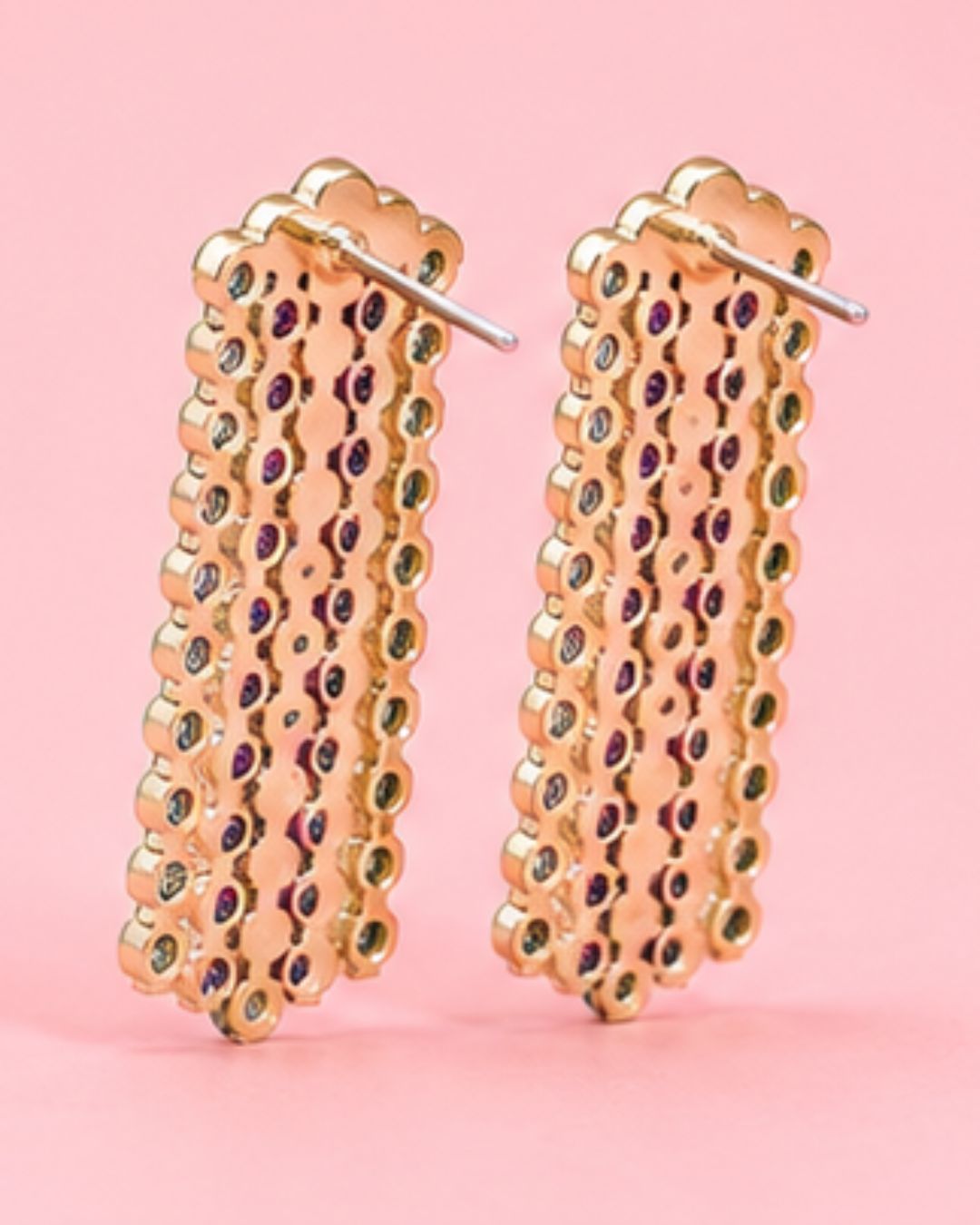 Pair of gold hoop earrings with multicolored stones back closure detail