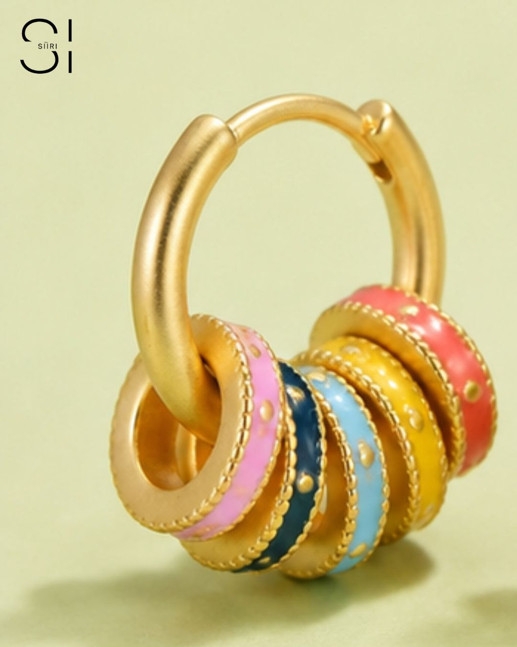 close up of the enamel charms on the gold plated huggies for woman daily wear