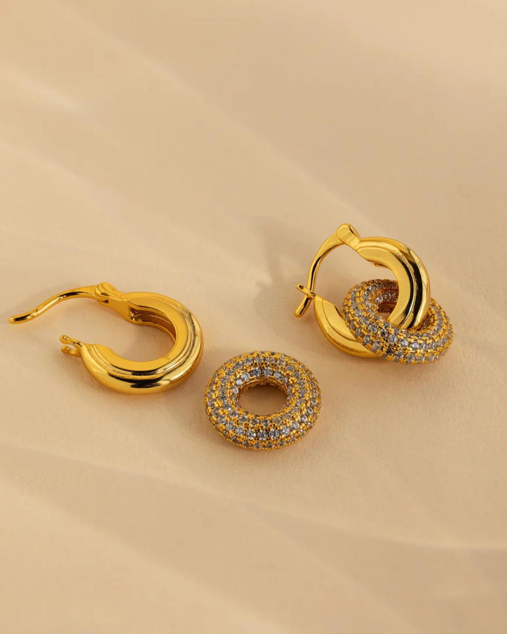 Close-up detail of Halo Glow Hoops with elegant drop design