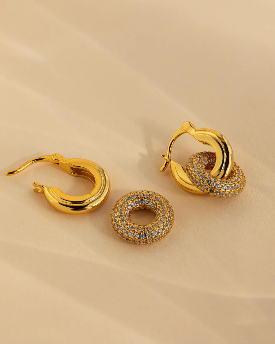 Close-up detail of Halo Glow Hoops with elegant drop design