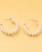 Detailed view of Pearl Loop Hoops with statement pearl arrangement and elegant hoop silhouette