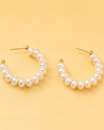 Detailed view of Pearl Loop Hoops with statement pearl arrangement and elegant hoop silhouette