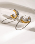 gold plated anti tarnish earrings Pair of gold and silver hoop earrings with chains on a white background