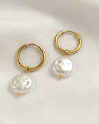 Gold hoop earrings with white pearls 