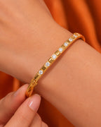 Gold bracelet with diamonds on a wrist 