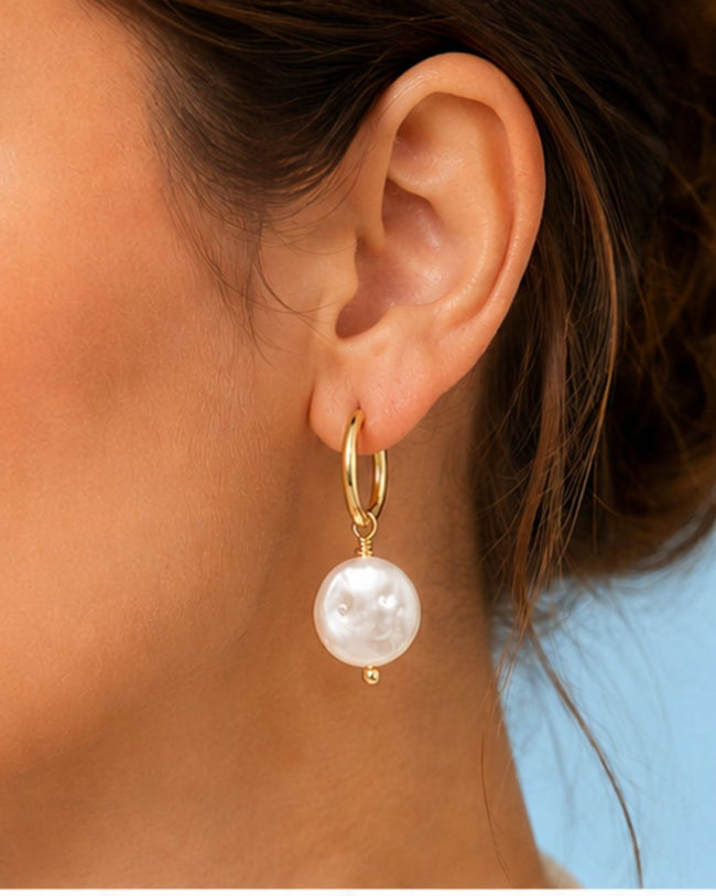 Pearl Drop Huggies with 18K gold plated hoop and elegant pearl charm detailing Hover Image