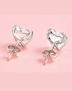 details of heart solitaire studs