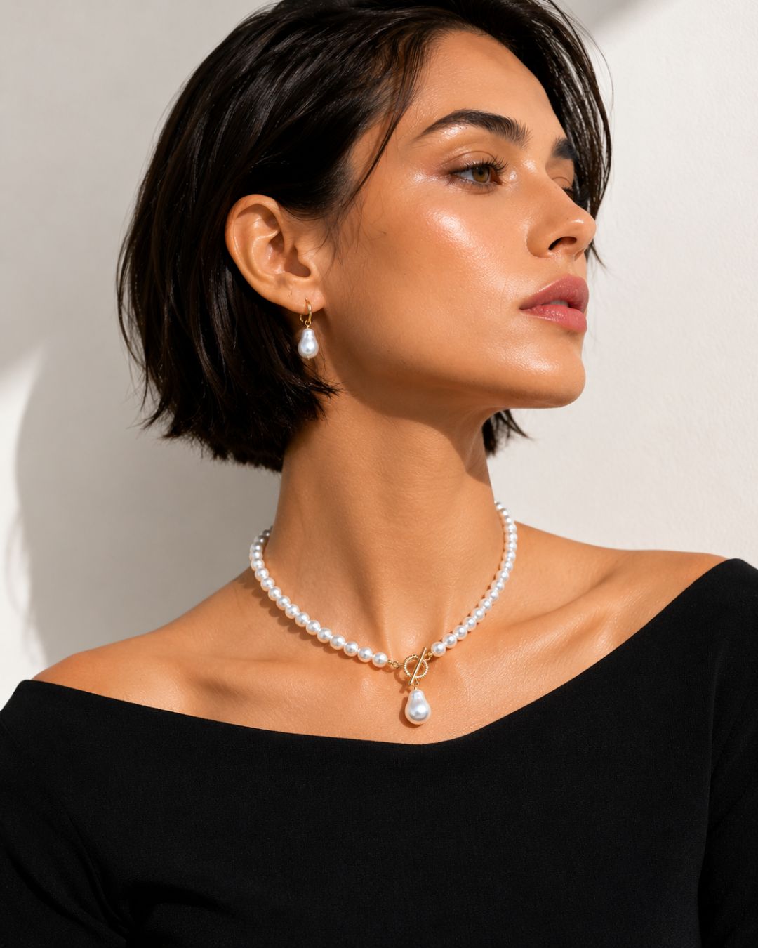Close-up of Luna Drop Pearl Necklace featuring pearl beads and drop pearl pendant with gold plated detailing styling