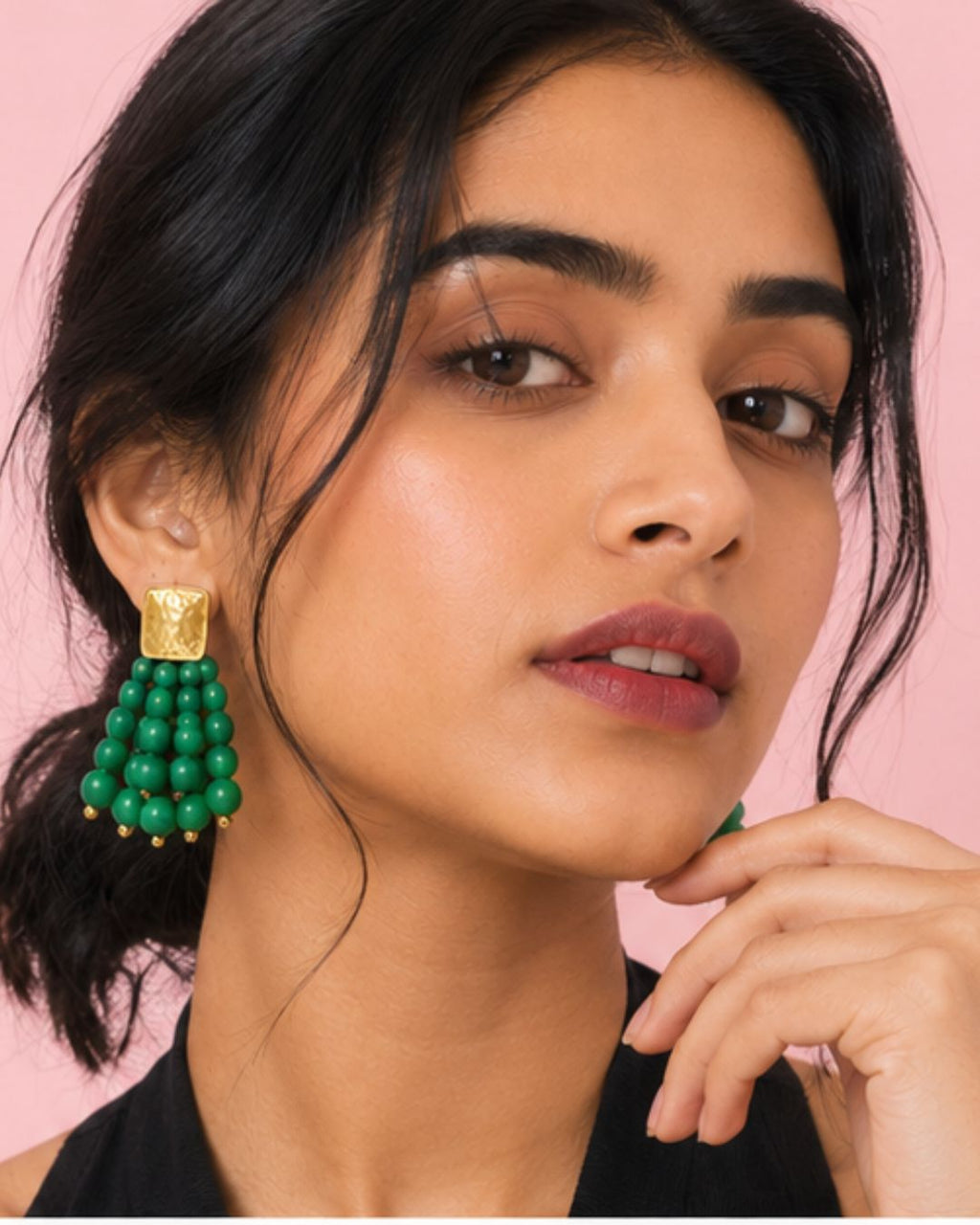 Model wearing Emerald Bead Cascade Earrings with vibrant green bead detailing
