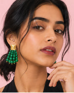 Model wearing Emerald Bead Cascade Earrings with vibrant green bead detailing