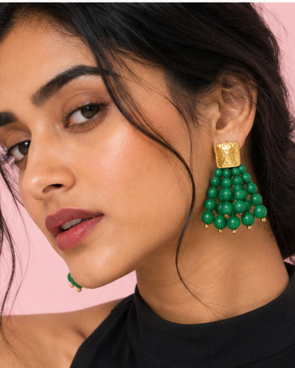 Model wearing Emerald Bead Cascade Earrings with vibrant green bead detailing