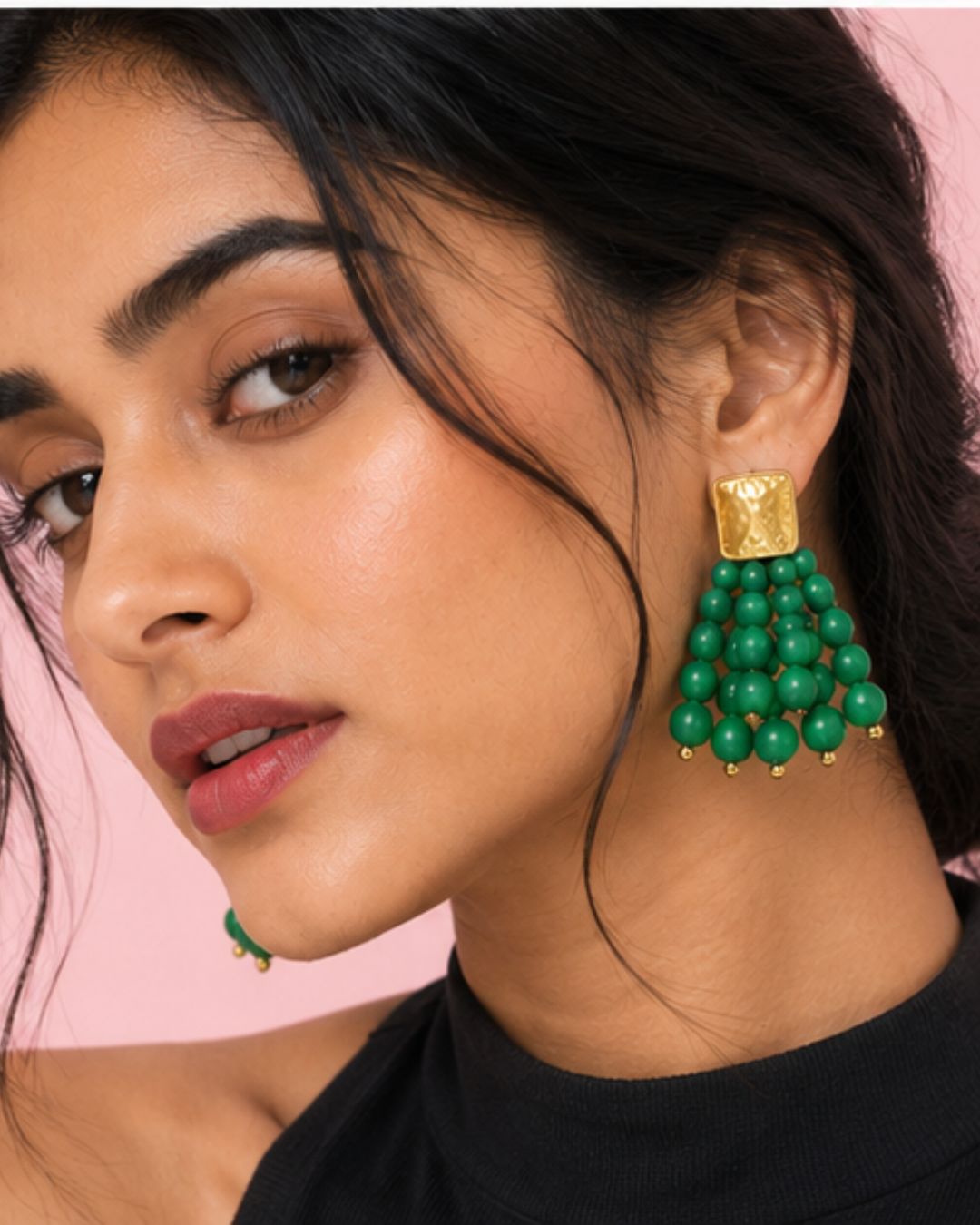 Model wearing Emerald Bead Cascade Earrings with vibrant green bead detailing