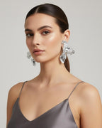 Woman wearing Hammered Floral gold plated drops and danglers for party and festive styling