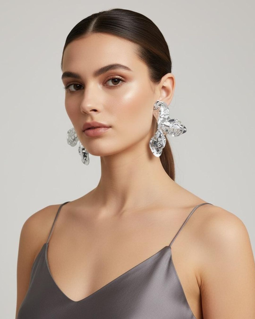 Woman wearing Hammered Floral gold plated drops and danglers for party and festive styling