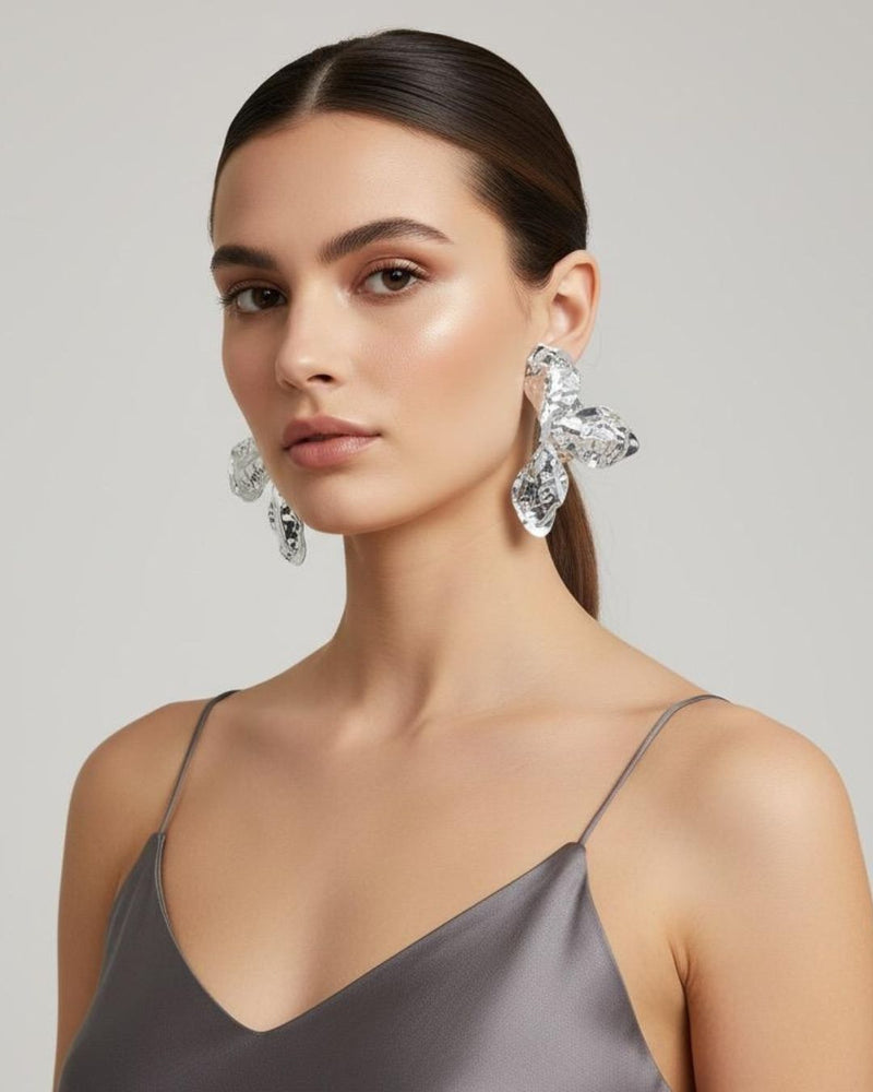 Woman wearing Hammered Floral gold plated drops and danglers for party and festive styling