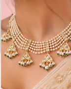 Gold plated wedding necklace set styled with ethnic attire