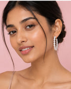 Woman wearing pearl earrings 