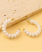 Pearl hoop earrings with gold accents 