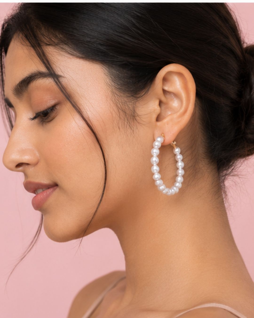 Woman wearing pearl hoop earrings for resort wear styling
