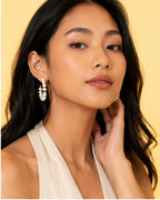 Model wearing Pearl Loop Hoops with classic pearl hoop styling resort party wear