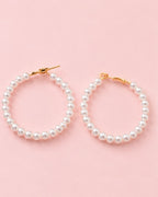 Close-up of Pearl Muse Hoops featuring lustrous pearl beads and gold plated accents