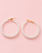 Close-up of Pearl Muse Hoops featuring lustrous pearl beads and gold plated accents