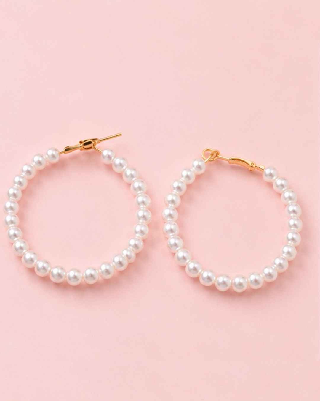 Close-up of Pearl Muse Hoops featuring lustrous pearl beads and gold plated accents