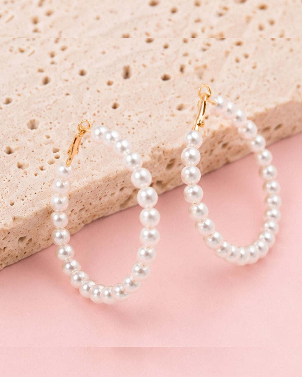 Detailed view of Pearl Muse Hoops with elongated pearl hoop silhouette and elegant craftsmanship