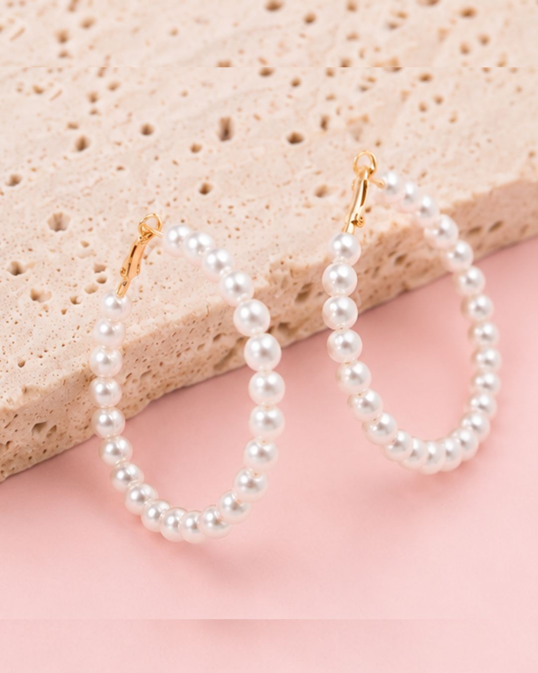 Detailed view of Pearl Muse Hoops with elongated pearl hoop silhouette and elegant craftsmanship