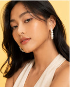 Model wearing Pearl Loop Hoops with classic pearl hoop styling