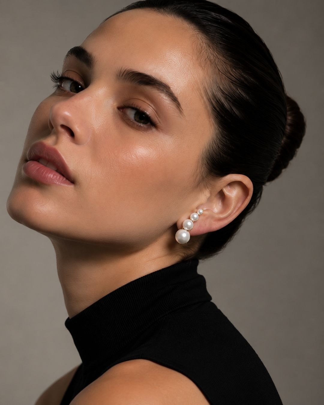 Close-up of Pearl Ear Climbers featuring pearl detailing and 925 silver ear cuff design