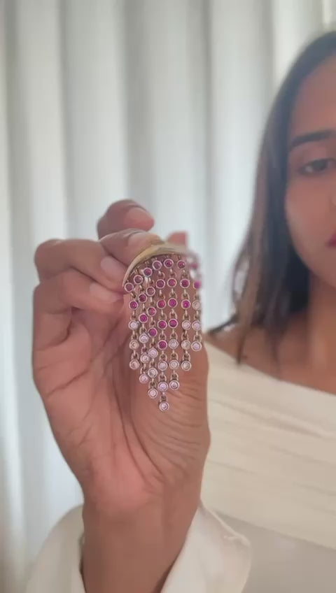 Close-up of White Aura Chandelier Earrings featuring cubic zirconia stones and gold plated finish