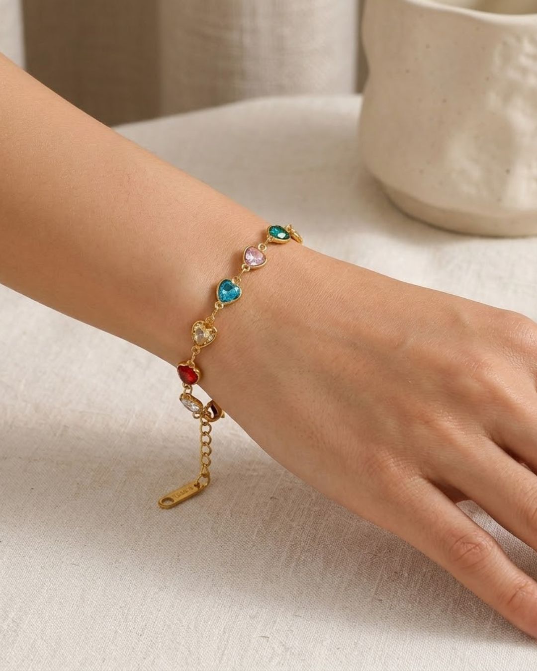 Bracelet with colorful heart-shaped beads on a wrist water proof demi fine jewelry
