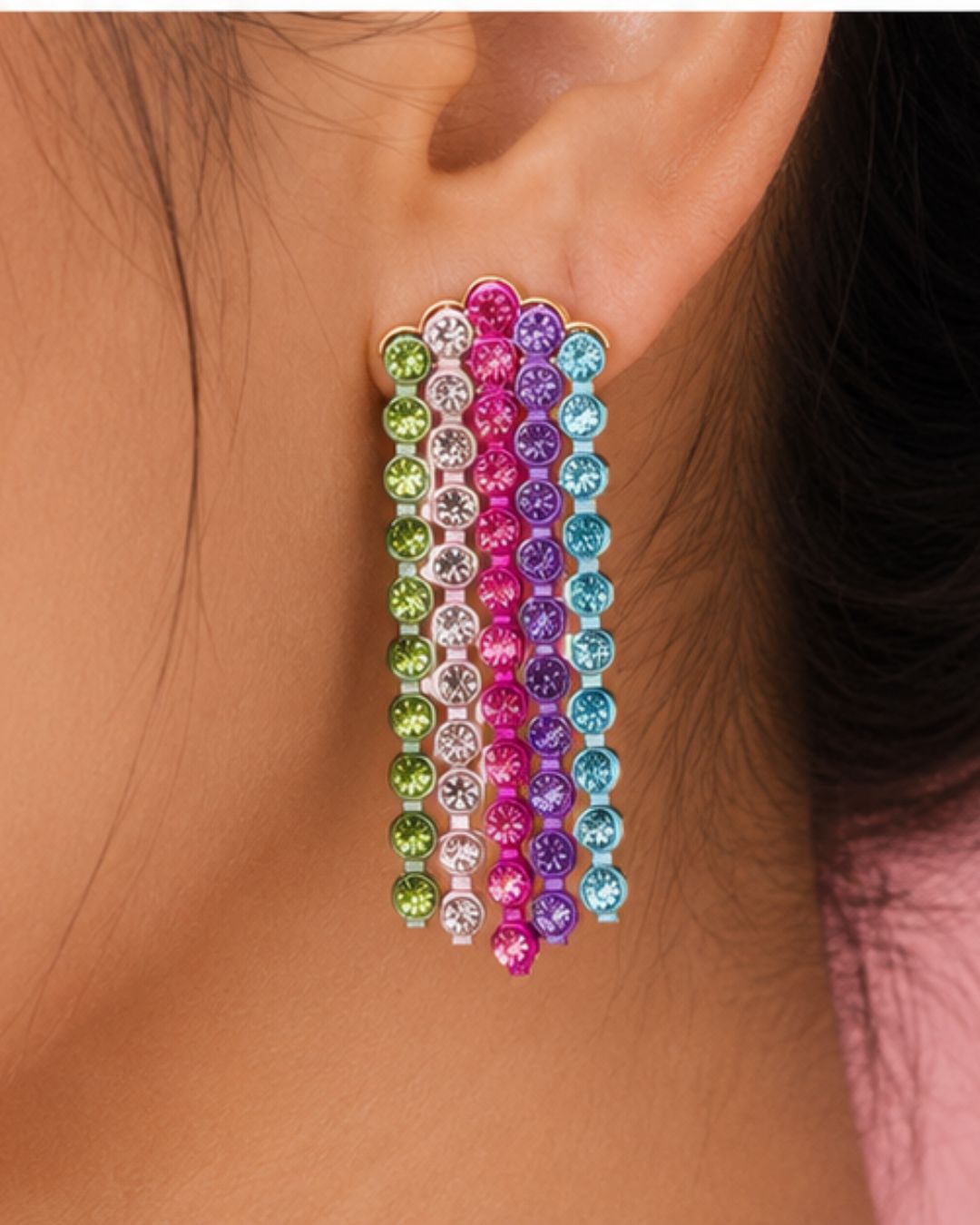 Close-up of rainbow crystal tassel earrings featuring colorful rhinestone strands