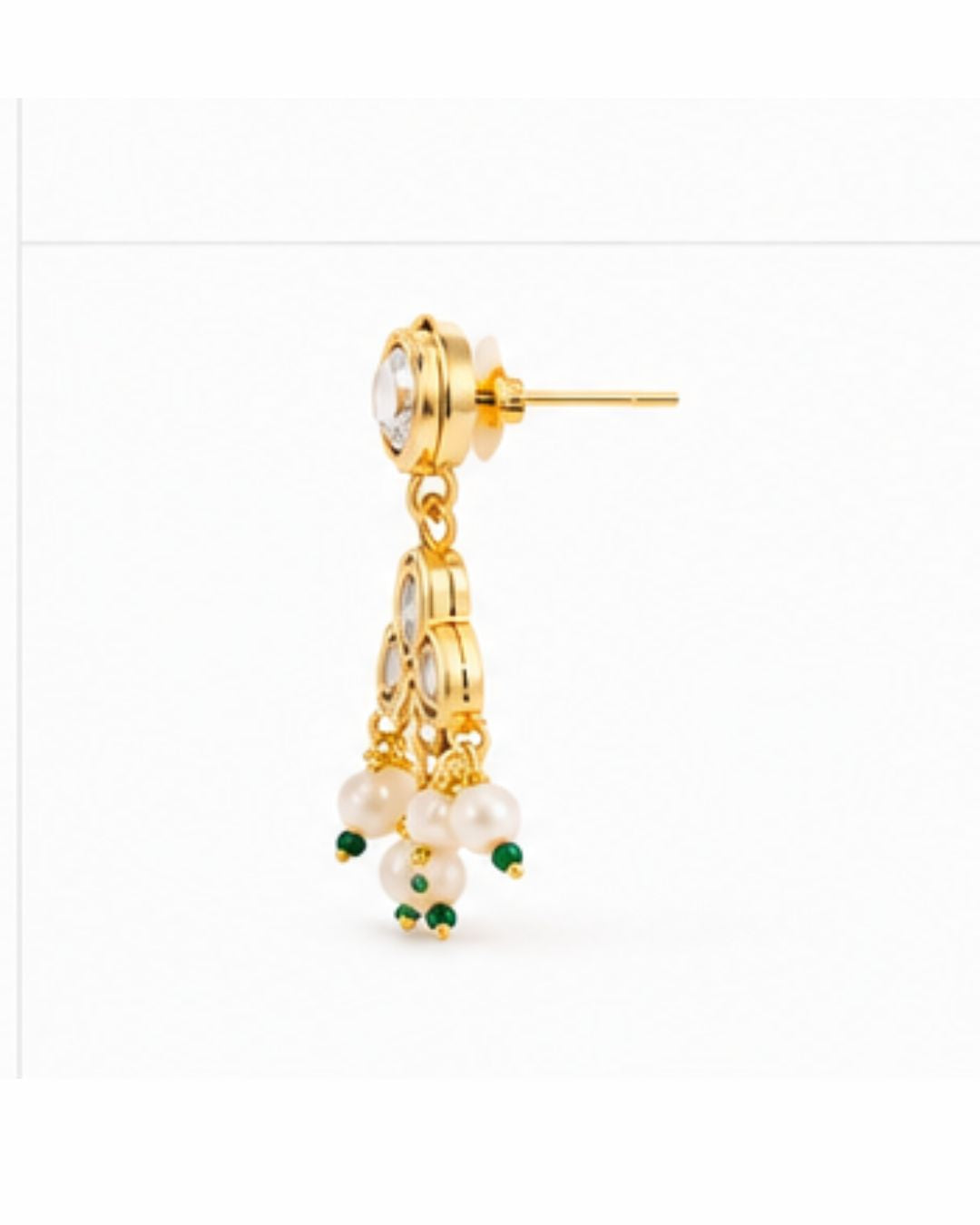 Gold earring with pearl and green gemstone drops on a white background