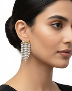 styling image of White Aura Chandelier Earrings in white stone variant with elegant CZ statement detailing